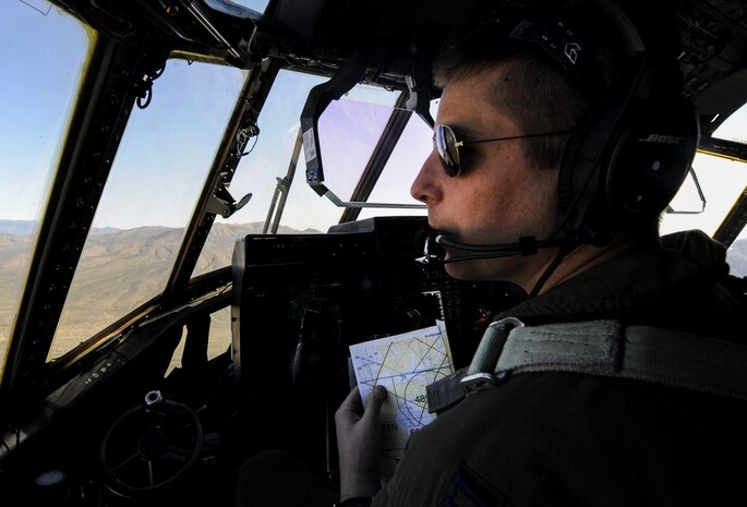 A pilot verifies coordinates on a map during a Weapons School Integration mission over the Nevada Test and Training Range, Nev., June 2, 2017. The students who take the Weapons School course demonstrate their ability to manage a battle and effectively integrate multiple weapons systems. (U.S. Air Force photo by Senior Airman Kevin Tanenbaum/Released) 
