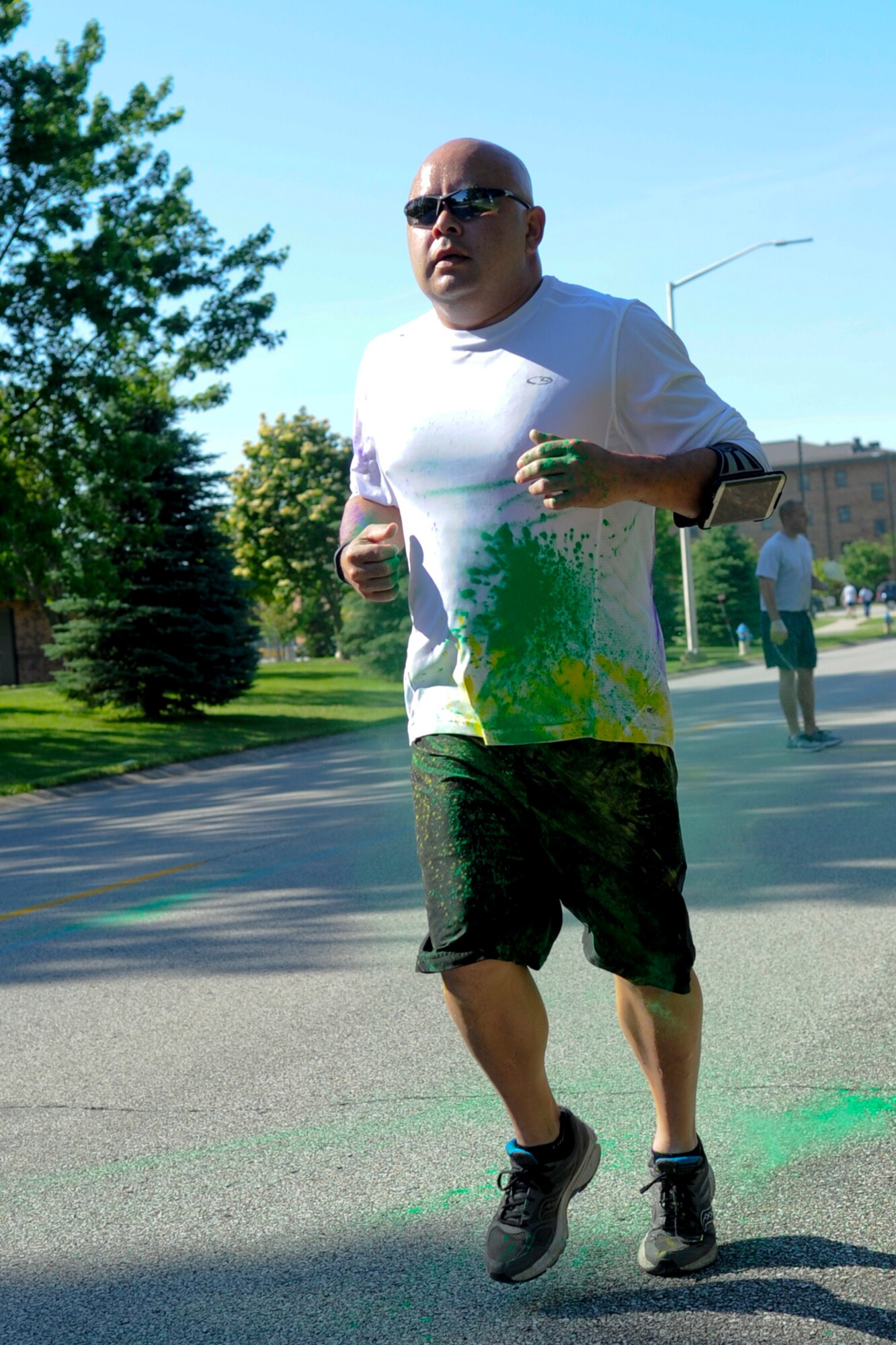 Michael Judson, 434th Logistics Readiness Squadron vehicle maintenance journeyman, runs through a burst of color during a 5K color fun run held June 3, 2017. This run was the kick-start to a very colorful, eventful family day. (U.S. Air Force photo/Senior Airman Cali Wetli)