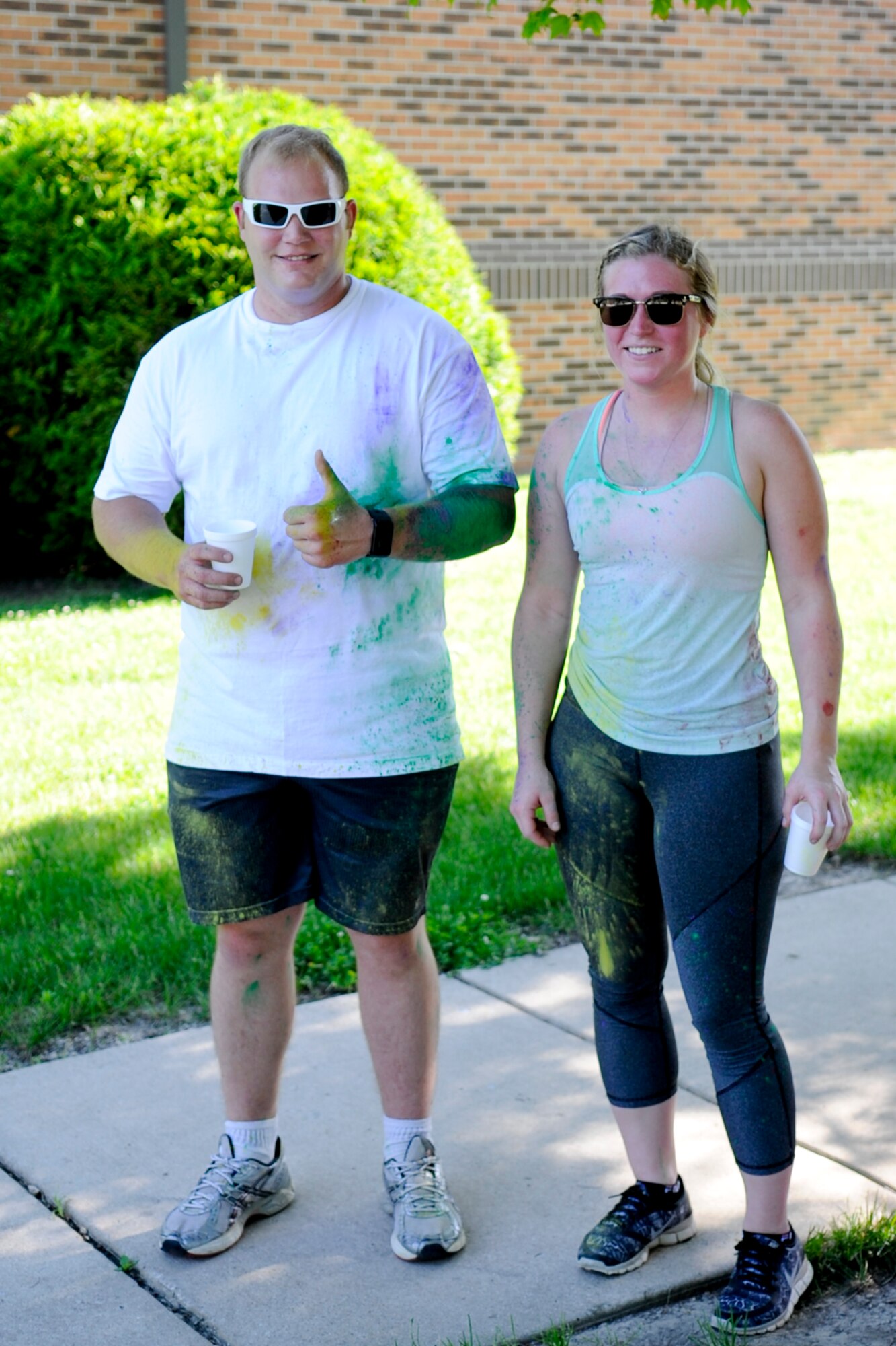 Lance Blackwell and Kelsey St. Clair, 434th Maintenance Squadron aircraft structural maintenance apprentices, pose for a photo after finishing a 5K color fun run held June 3, 2017. This run was the kick-start to a very colorful, eventful family day. (U.S. Air Force photo/Senior Airman Cali Wetli)