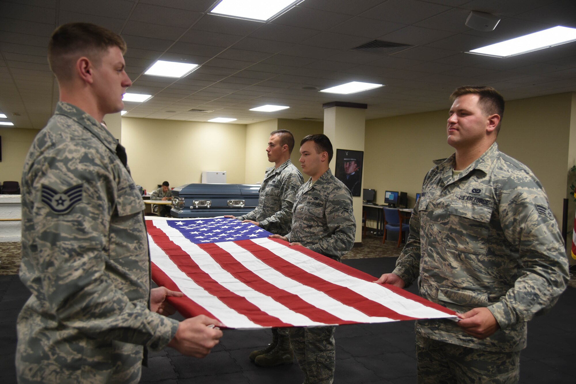 Fairchild Air Force Base honor guardsmen practice a six-man flag fold June 12, 2017, at Fairchild AFB, Washington. The Fairchild Honor Guard provides support for an average of seven funerals a week, but have supported upward of 20 funerals a week. (U.S. Air Force photo/Senior Airman Nick J. Daniello)