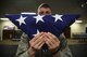 Staff Sgt. Marcus Hasse, Fairchild Air Force Base honor guardsmen, holds a folded American Flag June 12, 2017 at Fairchild Air Force Base, Washington. Fairchild’s ceremonial guardsmen maintain a region of 62,000 square miles, which covers many counties in Washington, Idaho and Oregon. The Fairchild Honor Guard is responsible for performing military honors to deceased Air Force veterans and retirees. (U.S. Air Force photo/Senior Airman Nick J. Daniello)