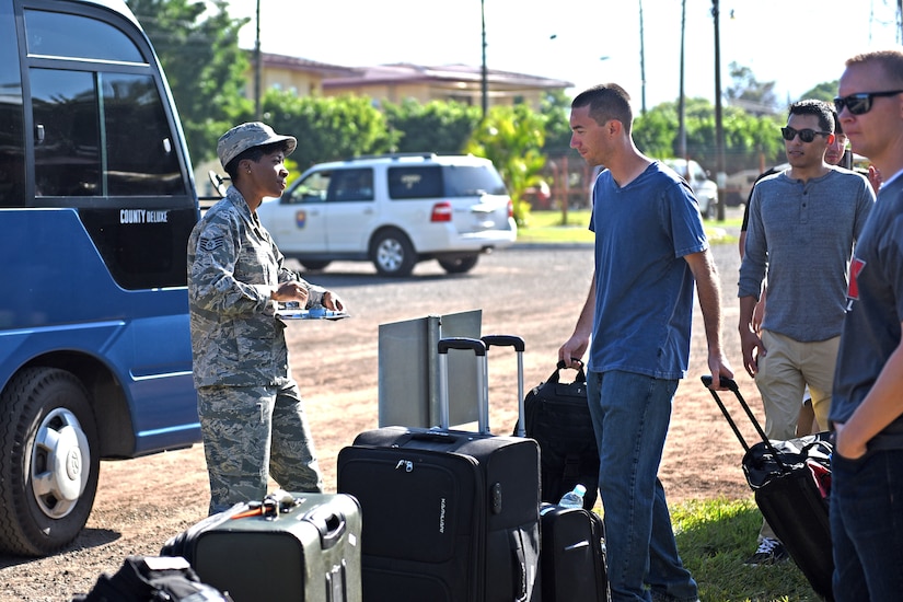 Staff Sgt. Jenerian Walters, Joint Task Force-Bravo personnel office, walks towards the Soto Cano shuttle bus that will transport deployed personnel returning home after completing their assignment at JTF-Bravo. Staff Sgt. Walters' Call to Duty as the Admin non-commissioned officer includes ensuring all personnel returning home turn in credentials and passes and that all service members who have signed in for their return trip make it to the bus. 