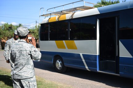 Staff Sgt. Jenerian Walters, Joint Task Force-Bravo personnel office, waves goodbye to departing personnel on the Soto Cano shuttle bus.  Staff Sgt. Walters’s Call to Duty includes being the first person service members see when arriving to Soto Cano Air Base and the last person they see when they depart, forming a connection with people as she sees their reaction to their arrivals and departures on base. Staff Sgt. Walters works as the Admin non-commissioned officer at JTF-Bravo’s personnel office. 