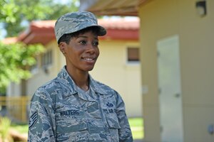 Staff Sgt. Jenerian Walters, Joint Task Force-Bravo personnel office, poses for a photograph in front of the J1 building at Soto Cano Air Base, Honduras, June 5, 2017. Staff Sgt. Walters’s Call to Duty begins at 7:45 am as she waits for the arrival of the Soto Cano shuttle bus that transports incoming and outgoing personnel to and from the airport. Staff Sgt. Walters works as the Admin non-commissioned officer at JTF-Bravo’s personnel office. 