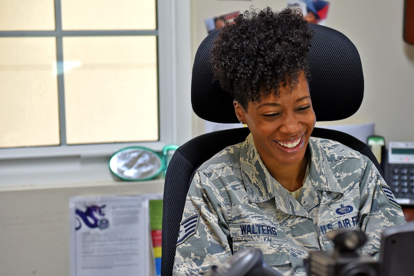Staff Sgt. Jenerian Walters, Joint Task Force-Bravo personnel office, smiles as she takes care of a customer visiting her office at her office at Soto Cano Air Base, Honduras, June 5th, 2017. Staff Sgt. Walters works as the Admin non-commissioned officer at JTF-Bravo’s personnel office and her Call to Duty includes making sure everyone has the proper credentials and working Common Access Cards for their computers. 