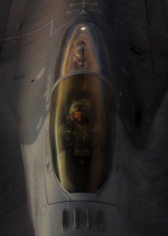An F-16 Fighting falcon pilot flies over the Nevada Test and Training Range as the aircraft is refueled by a KC-135 Stratotanker, June 8, 2017. The KC-135 Stratotanker provides the core aerial refueling capability for the U. S. Air Force and has excelled in this role for more than 50 years. (U.S. Air Force photo by Senior Airman Kevin Tanenbaum/Released)