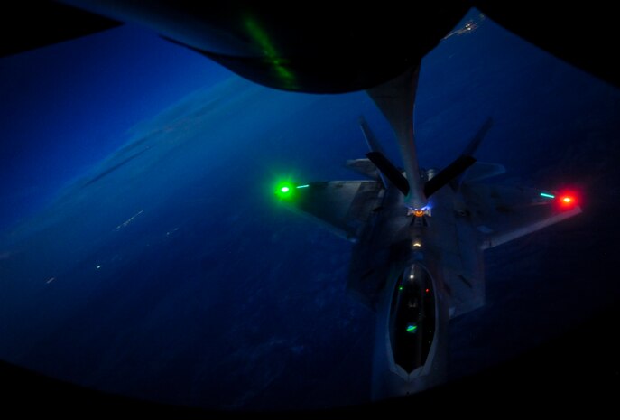An F-22 Raptor fighter jet, assigned to the 433rd Weapons Squadron, Nellis Air Force Base, Nev., is in-air refueled by a KC-135 Stratotanker during a Weapons School Integration mission over the Nevada Test and Training Range, June 8, 2017. The F-22 performs air-to-air and air-to-ground missions, allowing full realization of operational concepts vital to the 21st century Air Force. (U.S. Air Force photo by Senior Airman Kevin Tanenbaum/Released)