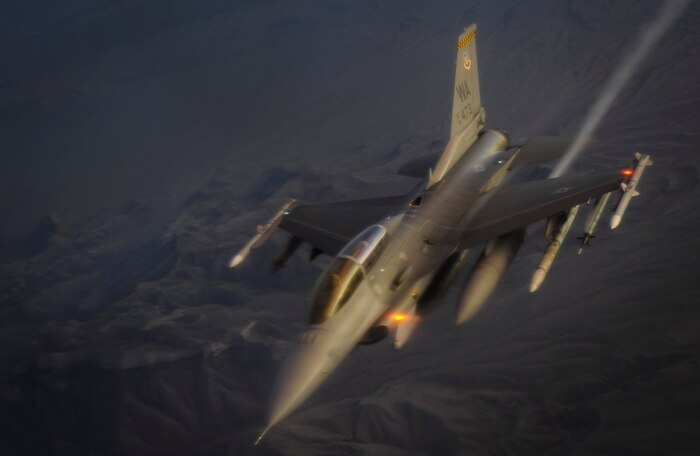 An F-16 Fighting Falcon fighter jet, assigned to the 57th Wing at Nellis Air Force Base, Nev., flies after being aerially refueled during a Weapons School integration mission over the Nevada Test and Training Range June 8, 2017. The F-16 is a compact, multi-role fighter aircraft. It is highly maneuverable and has proven itself in air-to-air combat and air-to-surface attack. (U.S. Air Force photo by Senior Airman Kevin Tanenbaum/Released)