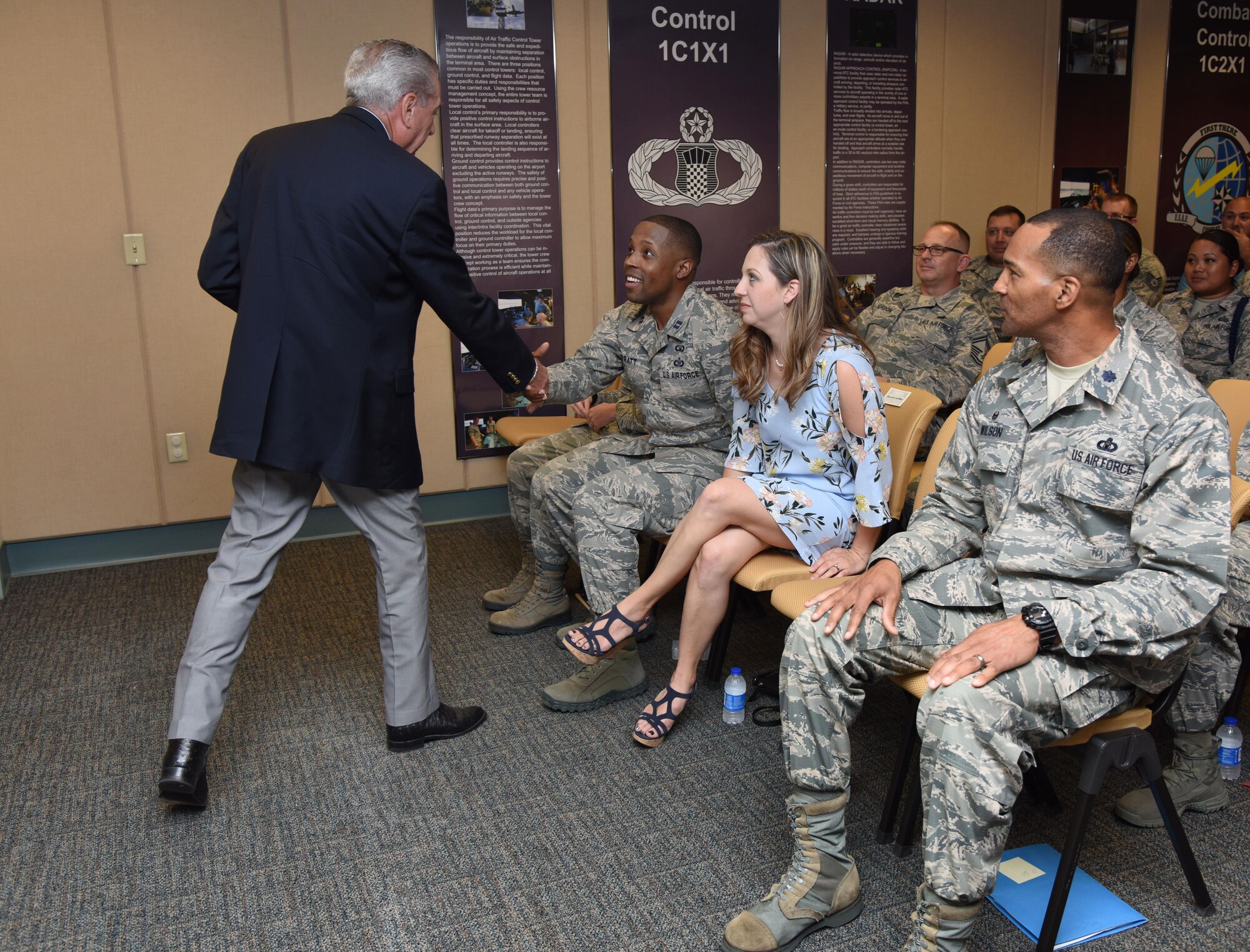 Retired Chief Master Sgt. Byron “BT” Parcenue introduces himself to Capt. Edwin Pratt, 81st Training Wing executive officer, during an awards presentation at Cody Hall June 8, 2017, on Keesler Air Force Base, Miss. Parcenue presented Pratt with the 2016 Air Education and Training Command Byron“BT” Parcenue Airfield Operations Professional of the Year Award. (U.S. Air Force photo by Kemberly Groue)