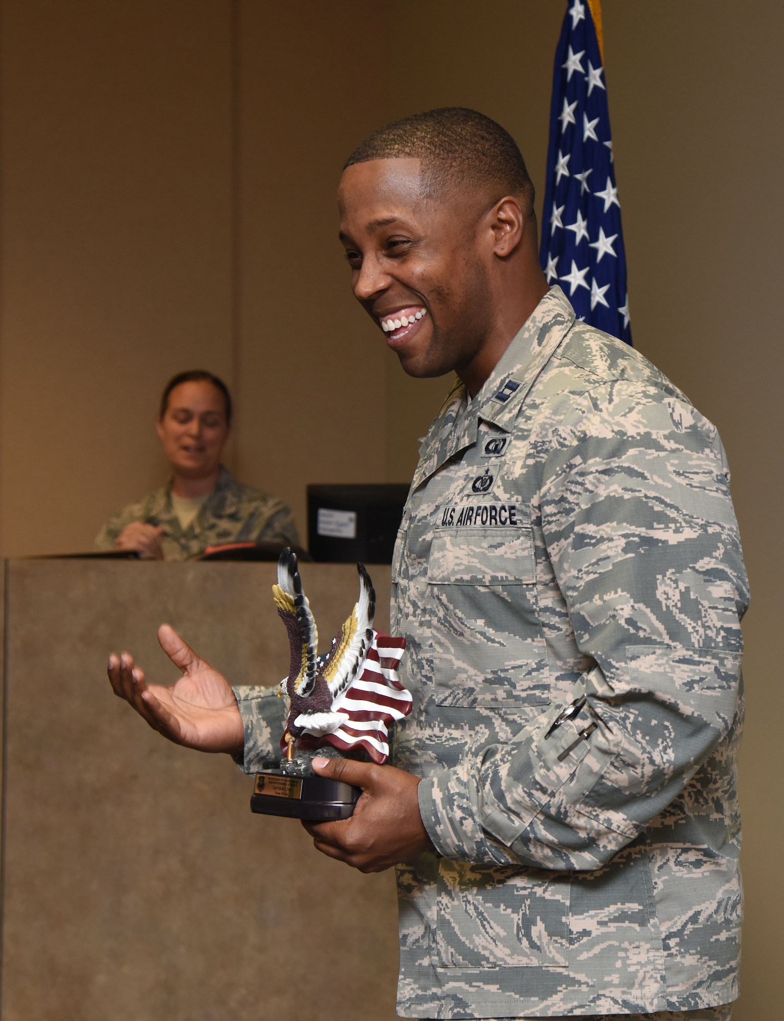 Capt. Edwin Pratt, 81st Training Wing executive officer, delivers comments after being presented with the Byron “BT” Parcenue Airfield Operations Professional of the Year award during an awards presentation at Cody Hall June 8, 2017, on Keesler Air Force Base, Miss. Retired Chief Master Sgt. Byron “BT” Parcenue presented the 2016 Air Education and Training Command Airfield Operations Annual Award named after him to Pratt. (U.S. Air Force photo by Kemberly Groue)