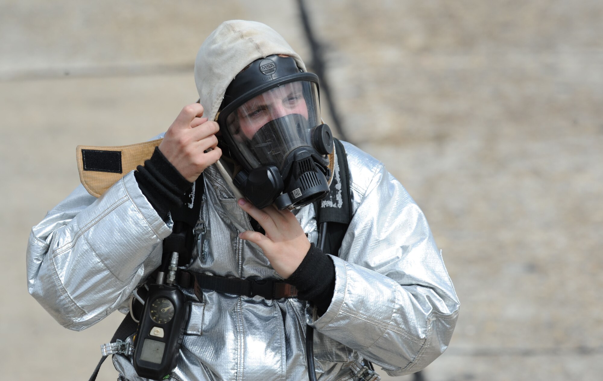 Senior Airman Jacob Linton, 81st Infrastructure Division firefighter, prepares to fight a fire during live fire exercise on the flightline June 7, 2017, on Keesler Air Force Base, Miss. The Keesler Fire Department, the Gulfport CRTC Fire Department and the Stennis Space Center Fire Department are all required to practice Aircraft Rescue and Fire Fighting procedures to meet a semi-annual training requirement. (U.S. Air Force photo by Kemberly Groue)