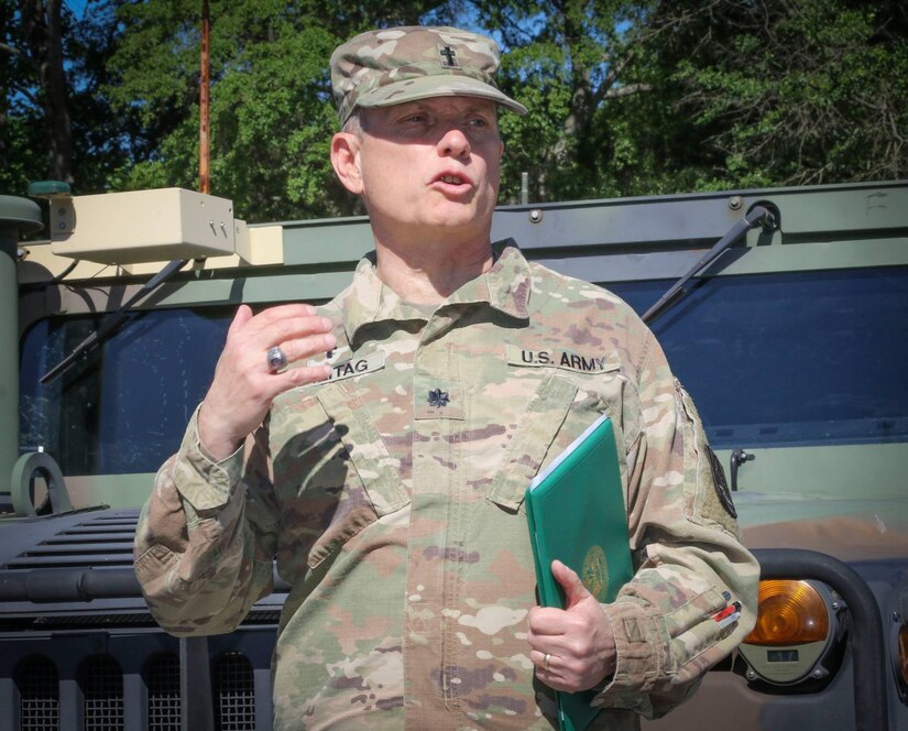 Army Reserve Lt. Col. James A. Freitag, staff chaplain, 335th Signal Command (Theater) addresses a group of Soldiers after being awarded a Meritorious Service Medal during an awards ceremony at the unit headquarters in East Point, Georgia in May.  Freitag, who is nearing retirement, is one of only two Soldiers in the history of the Army who has served as a command sergeant major and as a chaplain. (Official U.S. Army Reserve photo by Sgt. 1st Class Brent C. Powell)
