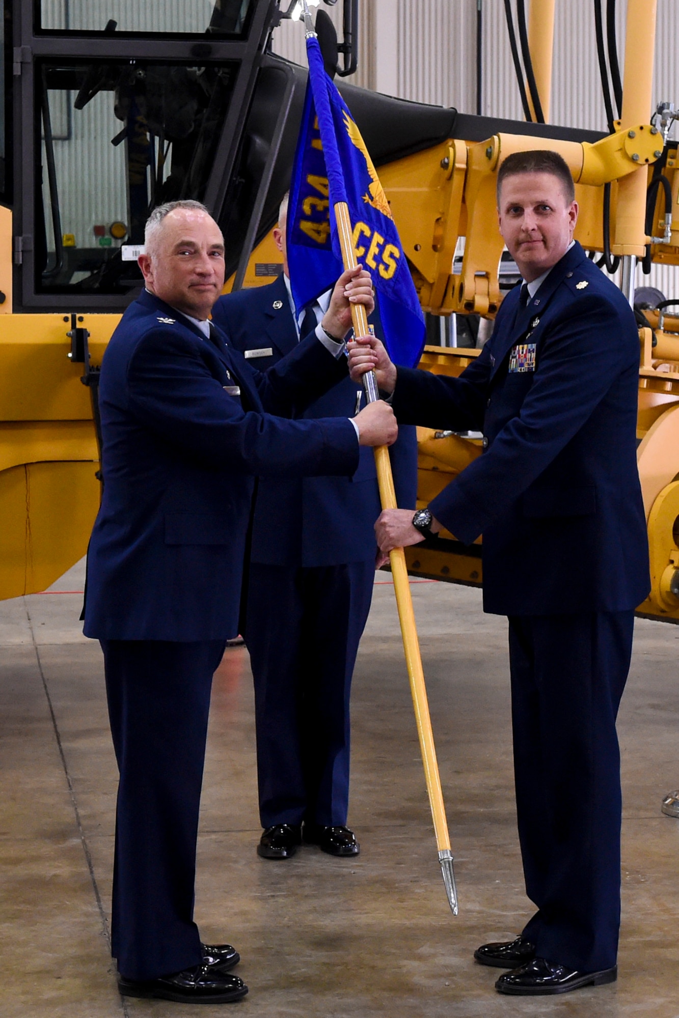 U.S. Air Force Maj. Timothy Kerrigan receives a guidon from Col. Scott Russell, 434th Mission Support Group commander during a change of command ceremony at Grissom Air Reserve Base, Ind., June 4, 2017. During the ceremony, Maj. Timothy Kerrigan took command of the 434th Civil Engineer Squadron. (U.S. Air Force photo/Senior Airman Cali Wetli) 