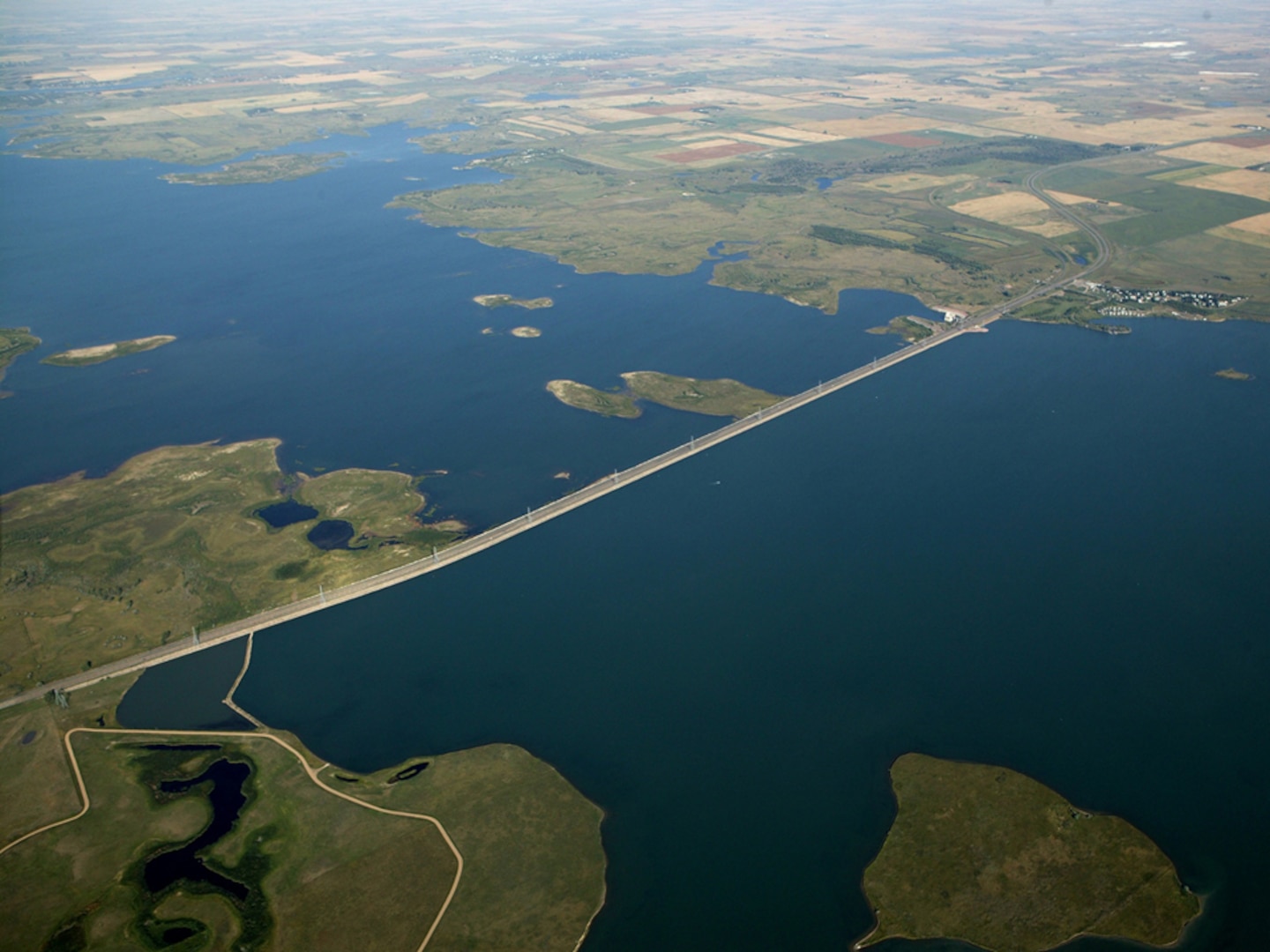 Snake Creek embankment with Highway 83 atop and Lake Sakakawea on the left and Lake Audubon on the right. 