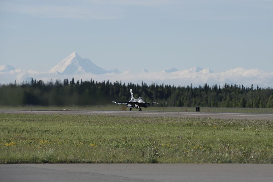 A U.S. Air Force F-16 Fighting Falcon aircraft assigned to the 18th Aggressor Squadron, speeds down the runway to take off from the Eielson Air Force Base, Alaska, flight line during RED FLAG-Alaska (RF-A) 17-2, June 13, 2017. RF-A provides an optimal training environment in the Indo-Asia Pacific region and focuses on improving ground, space and cyberspace combat readiness and interoperability of U.S. and international forces. (U.S. Air Force photo by Airman 1st Class Sadie Colbert)