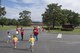 Children and volunteers cross the street to go play games at the Hoffman Auditorium during the base chapel's Vacation Bible School, June 7, 2017 at Moody Air Force Base, Ga. More than 80 people volunteered for this year's VBS and 105 children attended. (U.S. Air Force photo by Tech. Sgt. Zachary Wolf)