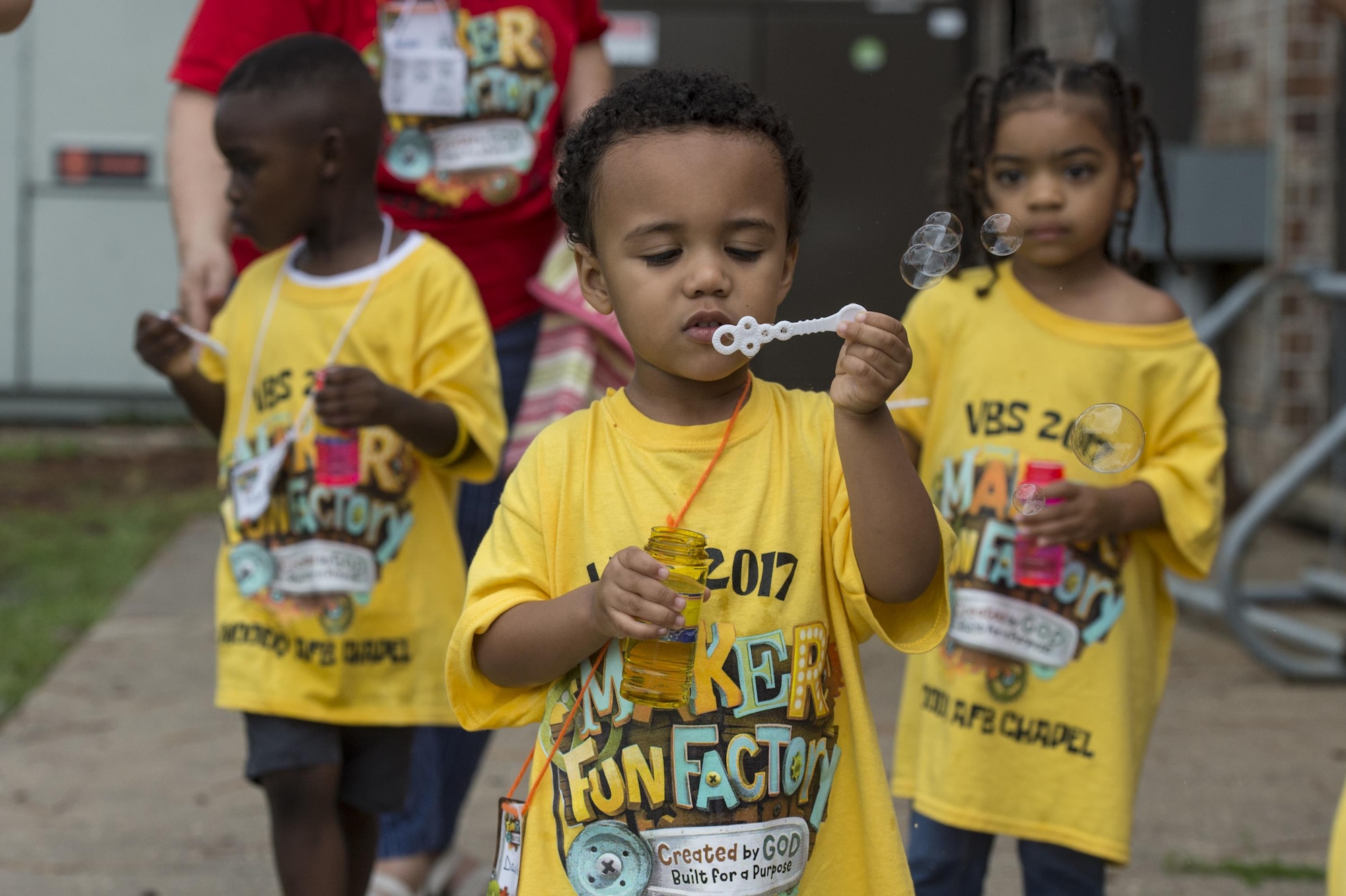Davion Baskerville, son of Tech. Sgt. Justin Baskerville, 823d Base Defense Squadron NCO in charge of logistics, blows bubbles during the base chapel's Vacation Bible School, June 7, 2017 at Moody Air Force Base, Ga. More than 80 people volunteered for this year's VBS and 105 children attended. (U.S. Air Force photo by Tech. Sgt. Zachary Wolf)