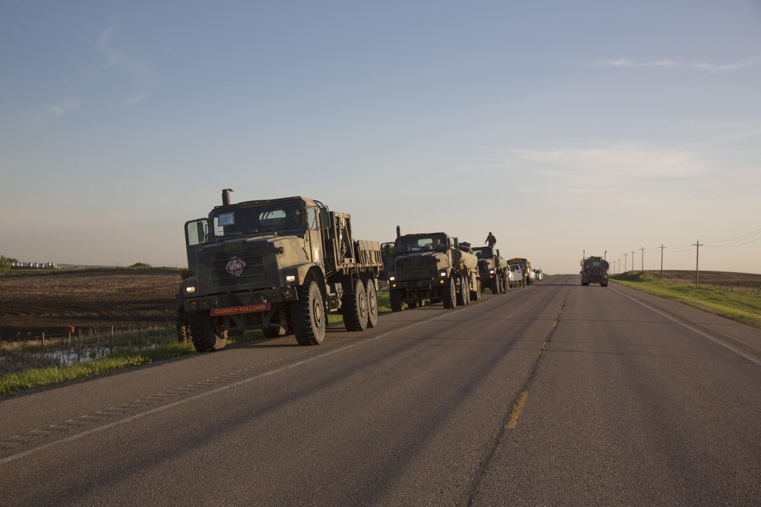 COLD LAKE, AB, CANADA -- Marines assigned to Marine Wing Support Squadron 473, 4th Marine Aircraft Wing, Marine Forces Reserve, pause at a checkpoint during a convoy to the Canadian Manoeuvre Training Centre, Camp Wainwright in Alberta, Canada, March 30, 2017, during exercise Maple Flag 50. MWSS-473 convoyed to the training center to provide real world refueling support to Royal Canadian Air Force CH-147 Chinook and CH-146 Griffon type model series during exercise Maple Flag 50. (U.S. Marine Corps Photo by Lance Cpl. Niles Lee)