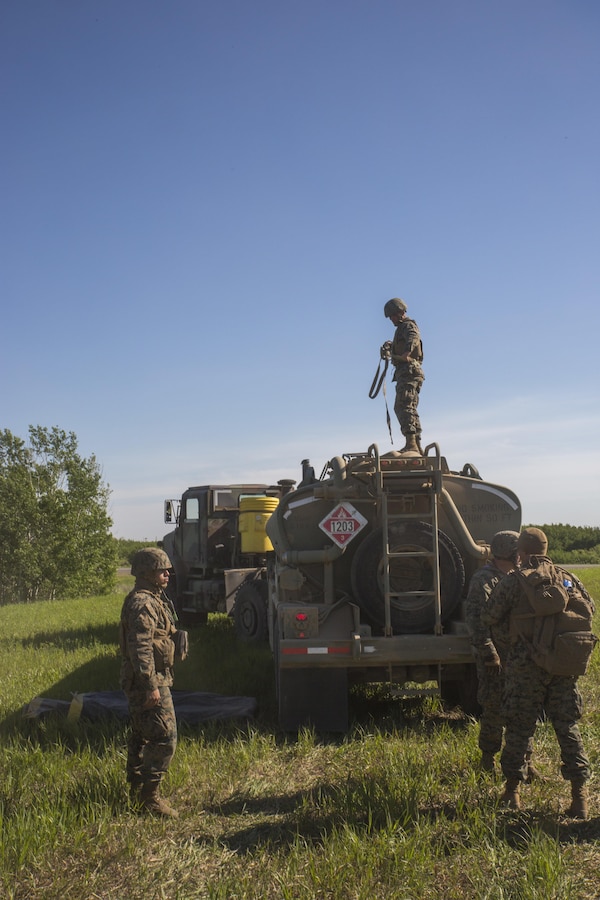 COLD LAKE, AB, CANADA -- Marines with Marine Wing Support Squadron 473, 4th Marine Aircraft Wing, Marine Forces Reserve, operate a forward arming and refueling point for Royal Canadian Air Force CH-147 Chinook and CH-146 Griffon type model series at the Canadian Manoeuvre Training Centre, Camp Wainwright in Alberta, Canada, May 30, 2017. Exercise Maple Flag prepares international aircrew, maintenance and support personnel for the rigours of operations in the modern aerial battlespace. (U.S. Marine Corps Photo by Lance Cpl. Niles Lee)