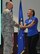 Col. Roger Suro, 340 Flying Training Group Commander, coins retired Staff Sgt. Sebastiana Lopez-Arellano after she shared her story of  resilience and recovery at the unit's spring MUTA on June 8 at Joint Base San Antonio-Randolph, Texas. Lopez-Arellano  lost her right leg in a 2015 motorcycle crash. She went on to compete and medal several times at the Air Force Warrior Games and Invictus. (Photo by Janis El Shabazz, 340 FTG Public Affairs).