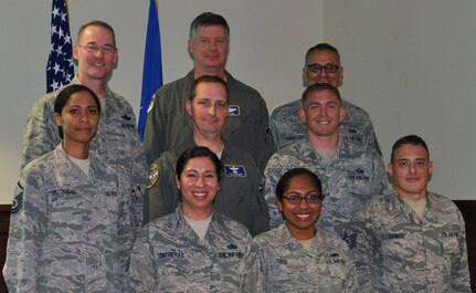 Col. Roger Suro, 340 Flying Training Group Commander (Top left), poses for a photo with members of the Group’s Undergraduate Flight Training team to celebrate their receipt of the Air Force Reserve Command's Gen. George Kenny Lessons Learned Award. The award was presented during the unit's spring MUTA held June 8-9 at Joint Base San Antonio-Randolph, Texas. Other members pictured are (top back row-center) Lt. Col. Lee Glenn, Senior Master Sgt. Samuel Caballero. (middle row l-r) Master Sgt. Tainell Pettengill, Lt. Col. Timothy Chapman and Master Sgt. Randy Alvis. (Front row) Master Sgt. Vianca Contreras, Tech. Sgt. Natasha Todd and Tech. Sgt. Brett Daniel. (Photo by Janis El Shabazz, 340 FTG Public Affairs).