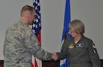 Col. Roger Suro, 340 Flying Training Group Commander, coins Lt. Col. Charlan Poirson at Joint Base San Antonio-Randolph, Texas.  Poirson was celebrated during the unit's MUTA, June 8-9 in recognition of her being named to the Key Personnel List and for her service as the Group’s Deputy Commander. She will soon depart for a new position working for Brig. Gen. Ellen Moore at the Air Reserve Personnel Center. (Photo by Janis El Shabazz, 340 FTG Public Affairs).