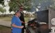 Master Sgt.Sarah Cornelius and Larry Tutor, 340 Flying Training Group Director of Staff, grill up burgers and brats during the Group picnic held after the Group's spring MUTA at Joint Base San Antonio, Texas, June 8-9. (Photo by Janis El Shabazz, 340 FTG, Public Affairs)