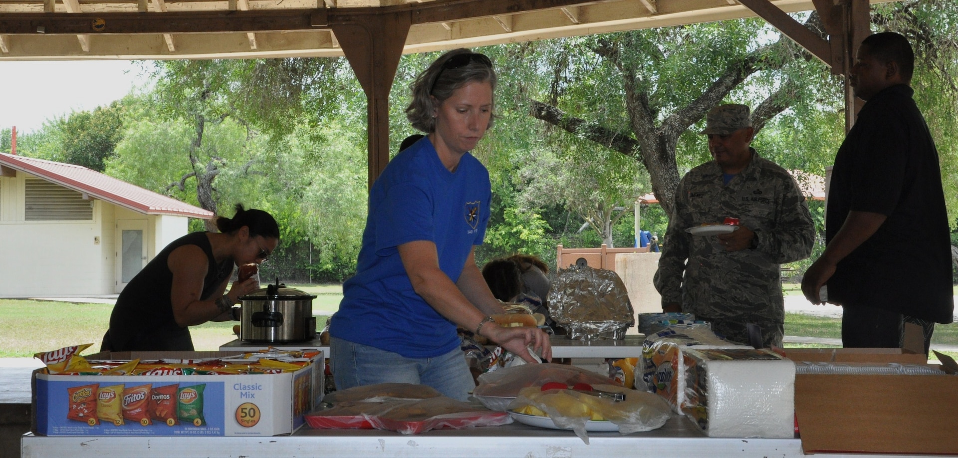 Maj. Teresa Davies, 340 Flying Training Group Deputy Chief, Plans and Programs (foreground), samples goodies at the Group's picnic after the unit's spring MUTA at Joint Base San Antonio, Texas, June 8-9. Other Citizen Airmen sampling the delights are (L-R) Maj. Joya Gamara, 340 FTG Executive Officer, Master Sgt. Joe Jimenez and Anthony Smith. (Photo by Janis El Shabazz, 340 FTG Public Affairs)