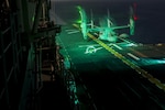 An MV-22B Osprey tiltrotor aircraft lands aboard the USS Bonhomme Richard (LHD 6) during nighttime flight operations. The Osprey belongs to Marine Medium Tiltrotor Squadron 265 (Reinforced). Marine aviators with VMM-265 (Rein.) and Marine Attack Squadron 311 (VMA-311), which combine to form the Aviation Combat Element of the 31st Marine Expeditionary Unit, refined their nighttime takeoff and landing capabilities during the training. The 31st MEU partners with the Navy's Amphibious Squadron 11 to form the amphibious component of the Bonhomme Richard Expeditionary Strike Group. The 31st MEU and PHIBRON 11 combine to provide a cohesive blue-green team capable of accomplishing a variety of missions across the Indo-Asia-Pacific region. 