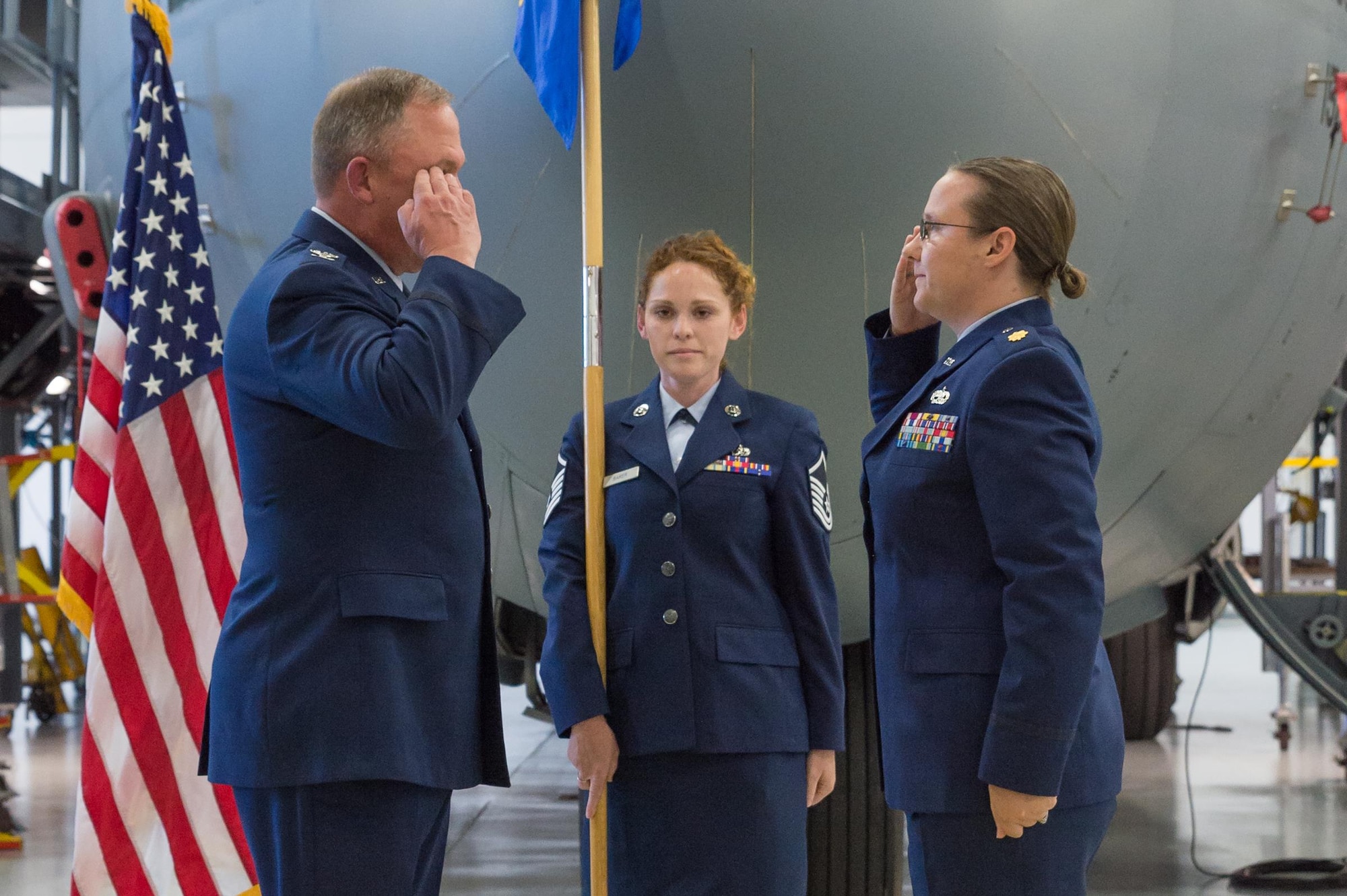 U.S. Air Force Col. Pete Linde, 153rd Maintenance Group commander, returns a salute from incoming 153rd Aircraft Maintenance Squadron commander Maj. Elizabeth Evans during an assumption of command ceremony June 10, 2017 in Cheyenne, Wyoming. Evans previously held the position of 153rd Maintenance Operations Flight commander. (U.S. Air National Guard photo by Senior Master Sgt. Charles Delano/released)