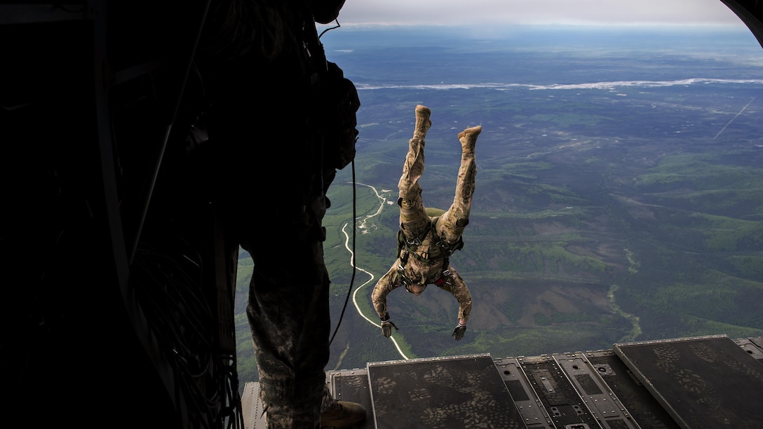 An airman jumps from a CH-47 Chinook during a Red Flag training mission at Eielson Air Force Base, Alaska, June 7, 2017. Red Flag includes training in ground, space and cyberspace readiness. Air Force photo by Staff Sgt. Paul Labbe