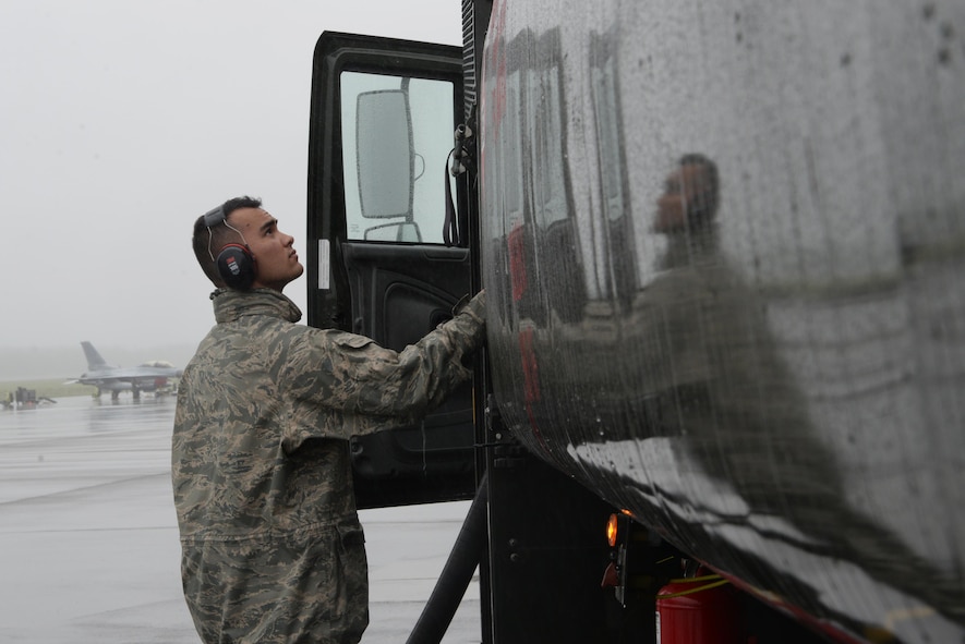 U.S. Air Force Airman 1st Class William Wyatt Sanders, a 354th Logistics Readiness Squadron fuels distribution operator, monitors his control panel gauges June 12, 2017, at Eielson Air Force Base, Alaska. Sanders refueled several aircraft in the rain during RED FLAG-Alaska 17-2, to ensure the aircraft were ready to complete the mission. (U.S. Air Force photo by Airman 1st Class Cassandra Whitman)