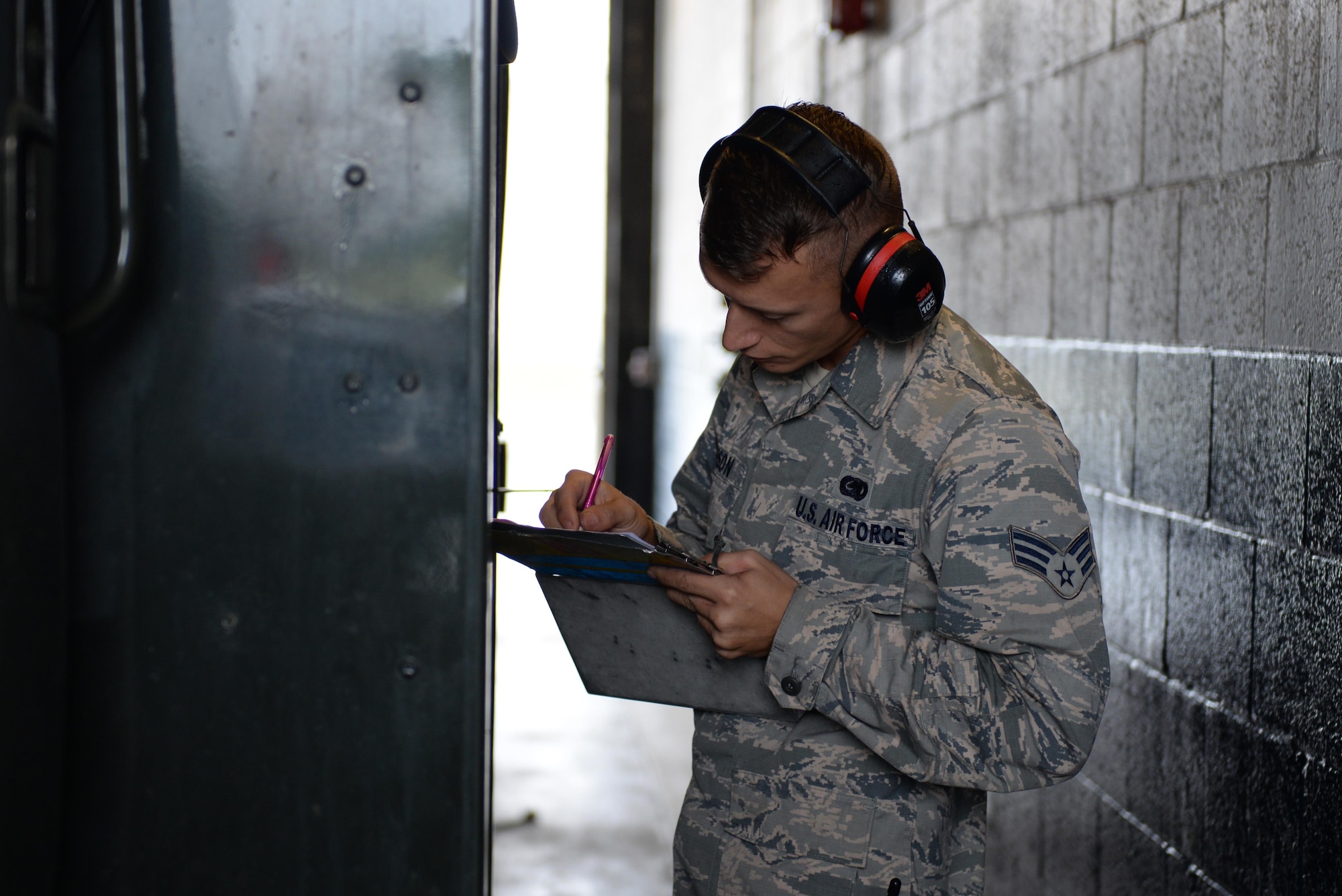 U.S. Air Force Senior Airman Mark Timson, a 354th Logistics Readiness Squadron fuels preventative maintenance personnel, performs daily checks on an R-11 June 12, 2017, at Eielson Air Force Base, Alaska. Timson performed a preventative maintenance check on a fuel truck to ensure all parts were functional before being dispatched to the flight line during RED FLAG-Alaska 17-2. (U.S. Air Force photo by Airman 1st Class Cassandra Whitman)