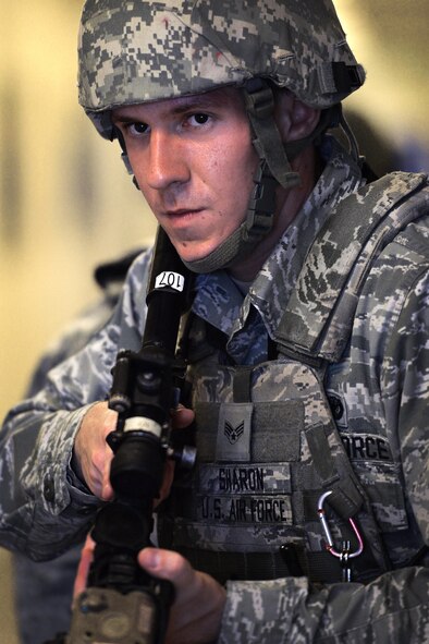 Senior Airman Bryce Sharon, 50th Security Forces Squadron responder, stays prepared to engage any threats during the base’s largest exercise of the year, Opinicus Vista 17-2, Wednesday, June 7, 2017. The exercise ran May 30-June 8, 2017, and tested the wing’s ability to respond to a natural disaster and an active shooter with a hostage. (U.S. Air Force photo/Dennis Rogers)