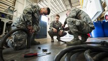 Members of the 91st Maintenance Group power, refrigeration, electrical, laboratory Global Strike Challenge team, disassemble electrical cables at Minot Air Force Base, N.D., May 30, 2017. Berthiaume helps prepare the team for Global Strike Challenge by simulating maintenance troubleshooting scenarios. (U.S. Air Force photo/Senior Airman J.T. Armstrong)