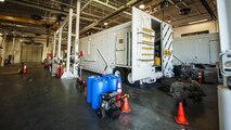 The 91 Maintenance Group power, refrigeration, electrical, laboratory Global Strike Challenge team works behind a payload transport trailer at Minot Air Force Base, N.D., May 31, 2017. The three-member PREL team is responsible for the inspection and maintenance of the payload transport trailer’s electrical systems and environmental climate control. (U.S. Air Force photo/Senior Airman J.T. Armstrong)