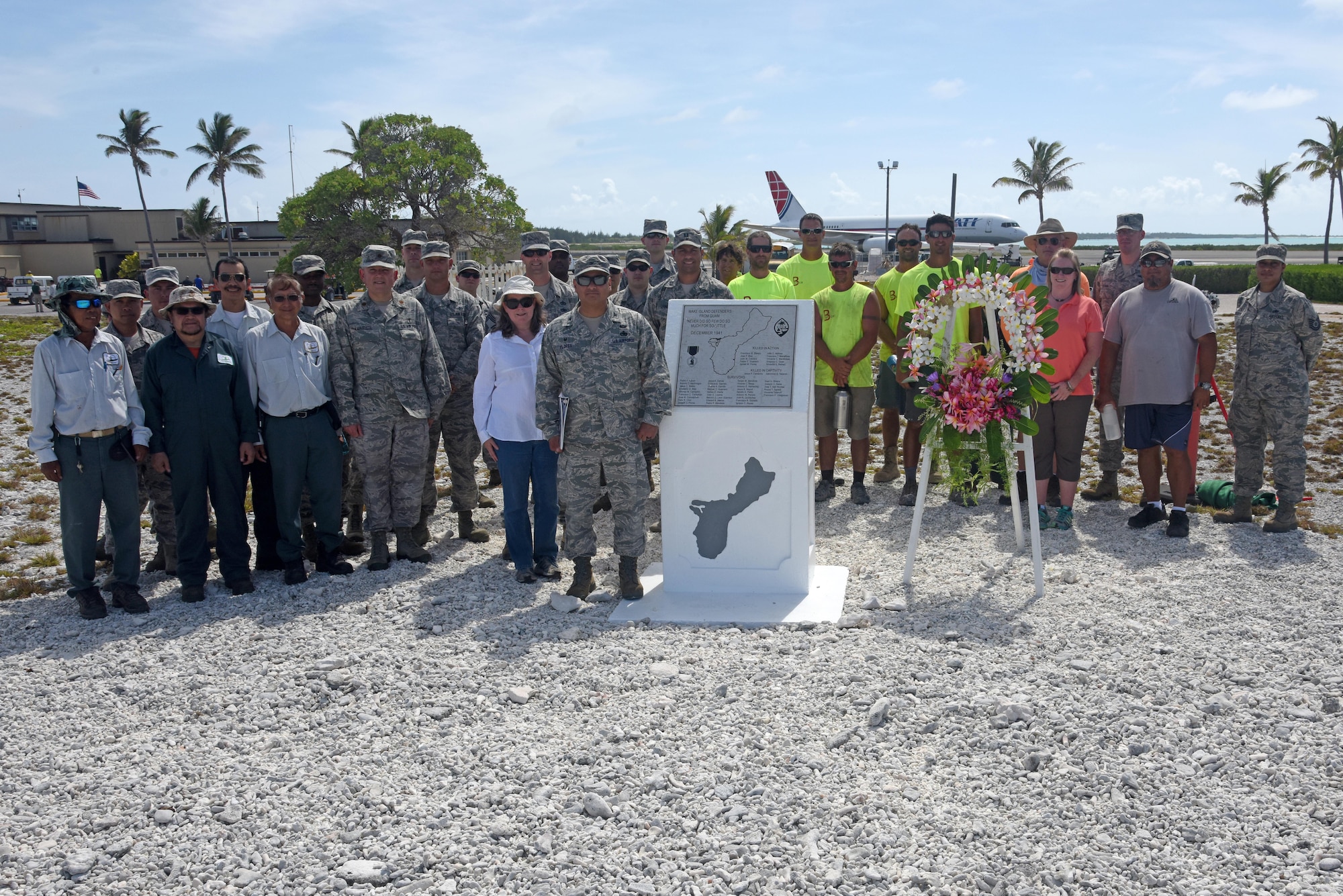 Attendees pose for a group photo during Wake Island’s Guam Memorial rededication ceremony June 8, 2017. The Guam Memorial on Wake Island was erected in 1991 to honor 45 Chamorros from Guam who worked for Pan American airlines. On Dec. 8, 1941, just a few hours of the attack on Pearl Harbor, Hawaii, Japanese forces attacked Wake Island and 10 of the 45 Chamorros were killed in the attack. The remaining 35 men were sent to prison camps in Japan and China where two died in captivity. Due to decades of corrosion, heat and sun, the memorial was degraded to the point where it became unreadable. During many months in 2017, the Guam Memorial was renovated to its original glory.