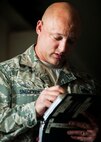 Tech. Sgt. Carl Snedeker, 91st Maintenance Group facility maintenance section site supervisor, runs through a checklist during Global Strike Challenge training at Minot Air Force Base, N.D., May 31, 2017. Snedeker is an alternate technician for the three-member PREL crew for GSC 17. (U.S. Air Force photo/Senior Airman J.T. Armstrong)