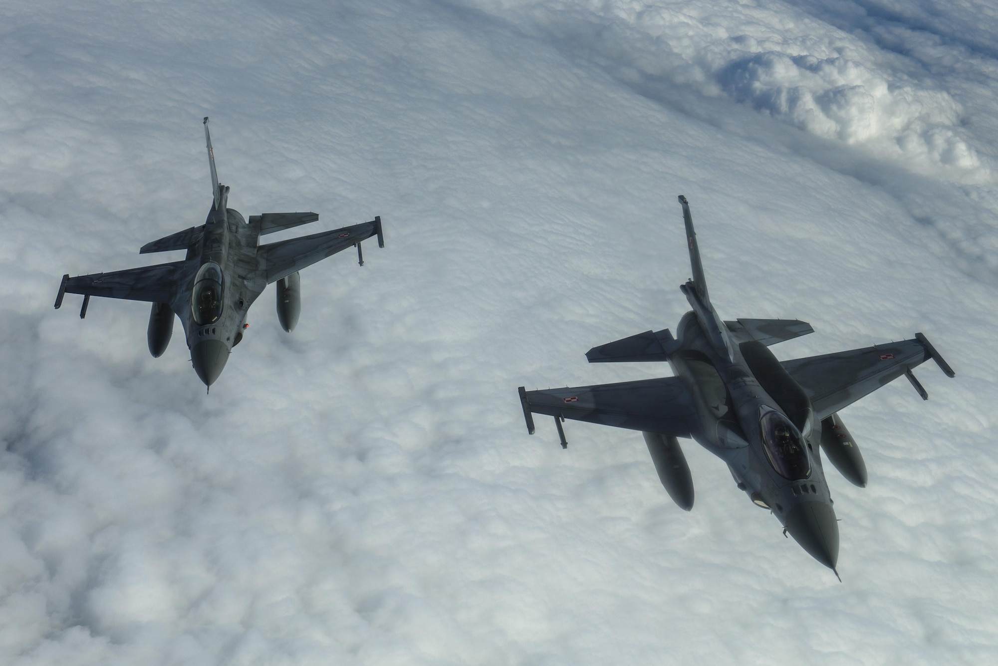 Polish air force F-16 Fighting Falcons fly in a two ship formation during BALTOPS over the Baltic Sea, June 13, 2017. BALTOPS is an annually recurring multinational exercise designed to enhance flexibility and interoperability, as well as demonstrate resolve of allied and partner forces to defend the Baltic region. Participating nations include Belgium, Denmark, Estonia, Finland, France, Germany, Latvia, Lithuania, the Netherlands, Norway, Poland, Sweden, the United Kingdom, and the United States. (U.S. Air Force photo by Staff Sgt. Jonathan Snyder)
