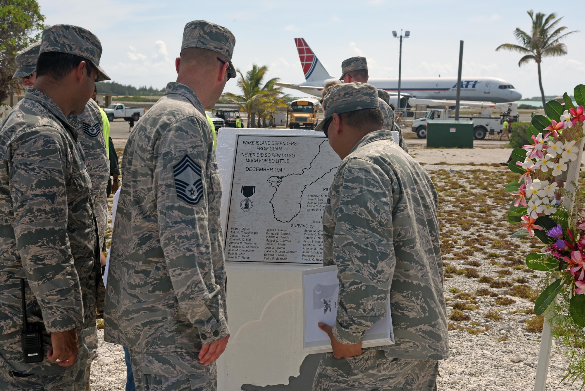 Col. Frank Flores (right), Pacific Air Forces Regional Support Center commander, Capt. Allen Jaime (left), Wake Island Det. 1 commander, PRSC, and Chief Master Sgt. David Boerman (middle), PRSC superintendent, admire the newly renovated memorial during the Guam Memorial rededication ceremony June 8, 2017. The Guam Memorial on Wake Island was erected in 1991 to honor 45 Chamorros from Guam who worked for Pan American airlines. On Dec. 8, 1941, just a few hours of the attack on Pearl Harbor, Hawaii, Japanese forces attacked Wake Island and 10 of the 45 Chamorros were killed in the attack. The remaining 35 men were sent to prison camps in Japan and China where two died in captivity. Due to decades of corrosion, heat and sun, the memorial was degraded to the point where it became unreadable. During many months in 2017, the Guam Memorial was renovated to its original glory.