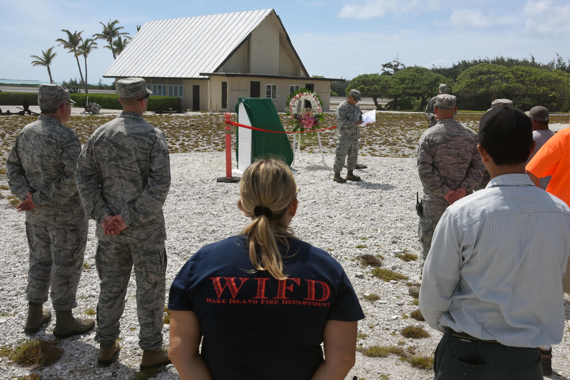 Col. Frank Flores, Pacific Air Forces Regional Support Center commander, describes the bravery and actions of 45 Chamorro men in the Battle of Wake Island during the Guam Memorial rededication ceremony June 8, 2017. The Guam Memorial on Wake Island was erected in 1991 to honor 45 Chamorros from Guam who worked for Pan American airlines. On Dec. 8, 1941, just a few hours of the attack on Pearl Harbor, Hawaii, Japanese forces attacked Wake Island and 10 of the 45 Chamorros were killed in the attack. The remaining 35 men were sent to prison camps in Japan and China where two died in captivity. Due to decades of corrosion, heat and sun, the memorial was degraded to the point where it became unreadable. During many months in 2017, the Guam Memorial was renovated to its original glory.