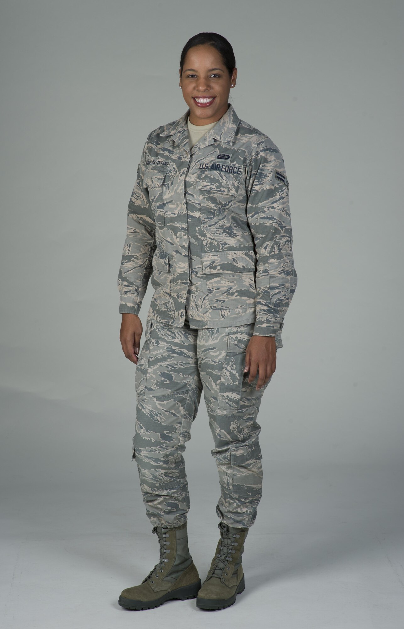 Airman 1st Class Cristine Barcellos Toffano, 60th Comptroller Squadron, poses for a photo at Travis Air Force Base, Calif., June 9, 2017. Barcellos Toffano grew up in Brazil and joined the U.S. Air Force in September 2016. As a member of the 60th CPTS, she is part of a diverse unit joining Airmen from seven different countries. (U.S. Air Force photo by Heide Couch)