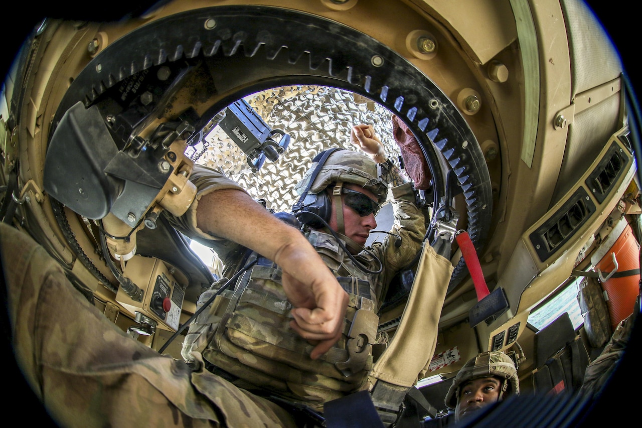 Army Cpl. Dean Craig chats with the truck crew in Mosul, Iraq, June 8, 2017, before moving to an advise and assist patrol base in a neighborhood liberated from the Islamic State of Iraq and Syria. Army photo by Staff Sgt. Jason Hull