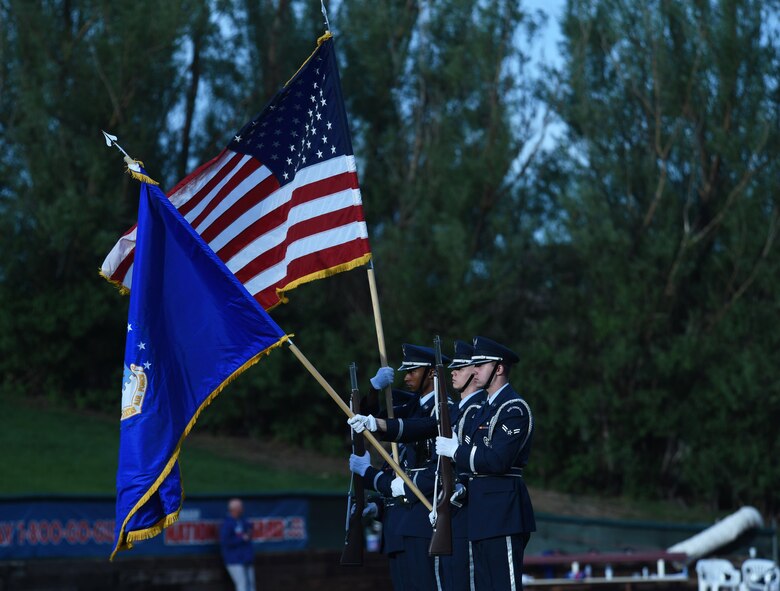 The High Frontier Honor Guard presents the colors during Sky Sox Air Force appreciation night in Colorado Springs, Colorado, Thursday, June 8, 2017.  The event also featured a first pitch from Col. Anthony Mastalir, 50th Space Wing vice commander, and Schriever’s Orbital Harmony Choir performances. (U.S. Air Force photo/Airman 1st Class William Tracy)