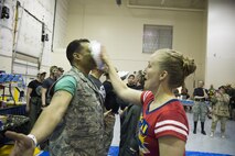 Airman 1st Class Krystal Conkling, then 50th Space Wing, smashes a pie in the face of Col. Jason Janaros, 50th Mission Support Group commander, during last year’s combat dining out at Schriever Air Force Base, Colorado, April 15, 2016. This year’s event will be Star Wars and Star Trek-themed and is open to the whole wing. (U.S. Air Force photo/Tech. Sgt. Julius Delos Reyes)