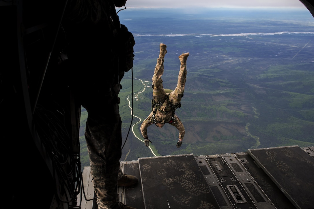 An Airman jumps out of a CH-47 Chinook during a Red Flag-Alaska 17-2 training mission at Eielson Air Force Base, Alaska, June 7, 2017. Red Flag-Alaska provides an optimal training environment to focus on improving ground, space, and cyberspace combat readiness and interoperability of U.S. and international forces. Air Force photo by Staff Sgt. Paul Labbe