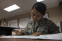 U.S. Air Force 1st Lt. Misha Ignacio, a 35th Operations Group intelligence officer out of Misawa Air Base, Japan, reviews an intelligence summary page during RED FLAG-Alaska 17-2, June 12, 2017, at Eielson Air Force Base, Alaska. The summary page includes air tasking orders as well as air operations directives used during mission planning. (U.S. Air Force photo by Airman 1st Class Sadie Colbert)