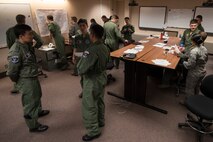 Republic of Korea Air Force, U.S. Air Force and Japan Air Self-Defense Force members begin mission planning during RED FLAG-Alaska (RF-A) 17-2, June 12, 2017, at Eielson Air Force Base, Alaska. RF-A is a two-week, multilateral large force exercise with many other nations, including Denmark, Finland and Israel, who participate to better overall tactics as one cohesive unit. (U.S. Air Force photo by Airman 1st Class Sadie Colbert)
