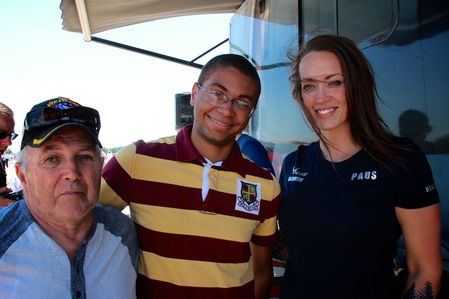 At far right, Tech. Sgt. Brittany Paus, 932nd Airlift Wing recruiter, thanks a Vietnam veteran for his service and explains the reserve benefits available to a potential college recruit on June 11, 2017.  Several unit members told their particular stories about their unique jobs to the public at the sunny, but sometimes quite windy and hot, summer Air Show at Scott Air Force Base, Illinois.  She reminded current members about the www.Get1Now.us program and the toll free number that can be called for more information at 1-800-257-1212.  (U.S. Air Force photo by Lt. Col. Stan Paregien)