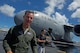U.S. Air Force Maj. Gen. Mark Dillon, Pacific Air Forces vice commander, is greeted by family and friends and soaked in water and champagne after his C-17 fini-flight at Joint Base Pearl Harbor-Hickam, Hawaii, June 12, 2017. With Dillon's retirement approaching, the fini-flight is the capstone event of his flying career. (U.S. Air Force photo/Tech. Sgt. Kamaile Chan)